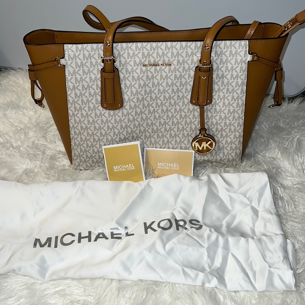 I’m Selling a Large Michael Kors Bag. The colors are Tan&Cream shoulder bag.